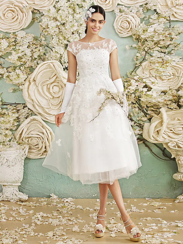 Close-up of the halter neckline and sequin criss-cross on chiffon wedding dress.
