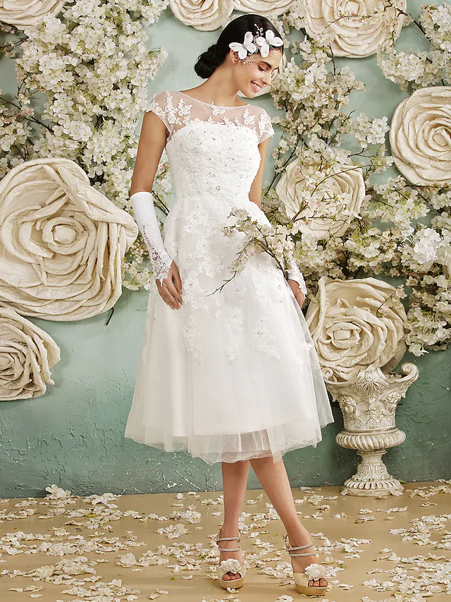 Side view of the floor-length A-line wedding dress silhouette.