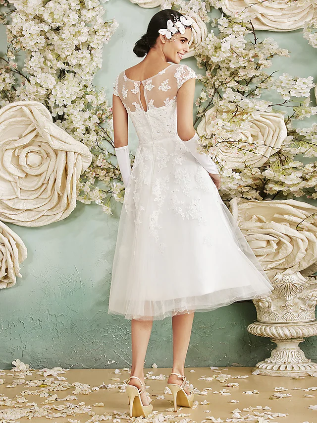 Full length view of the A-line halter neck wedding dress.