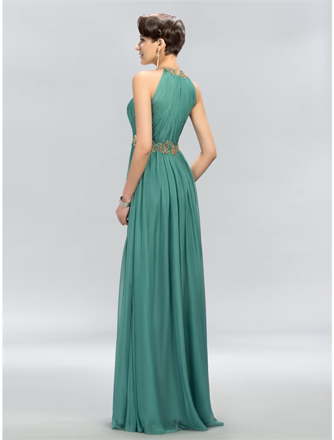 Back view of A-line halter chiffon maxi dress showing flowing skirt.