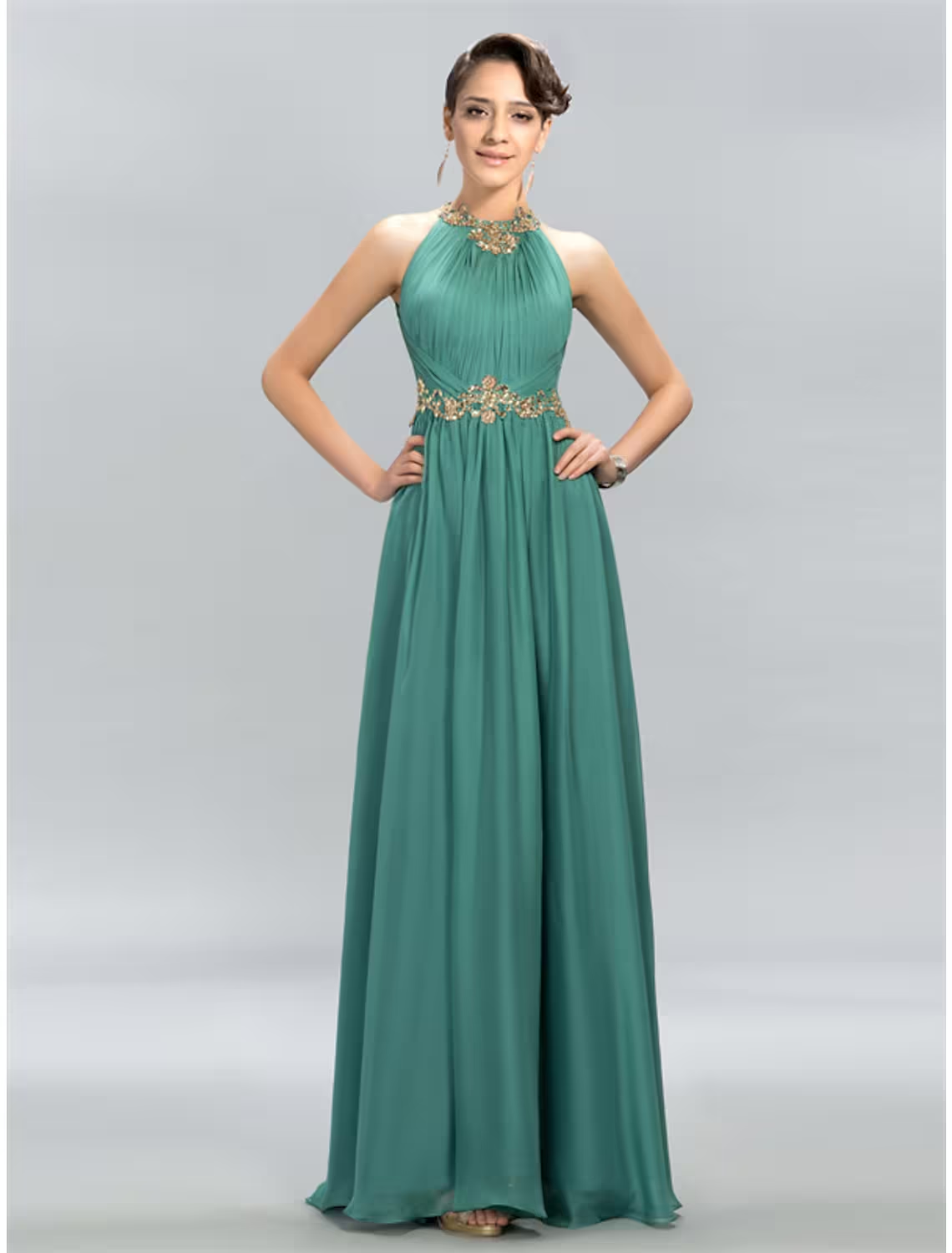 Side view of A-line halter chiffon maxi dress with ruched details.