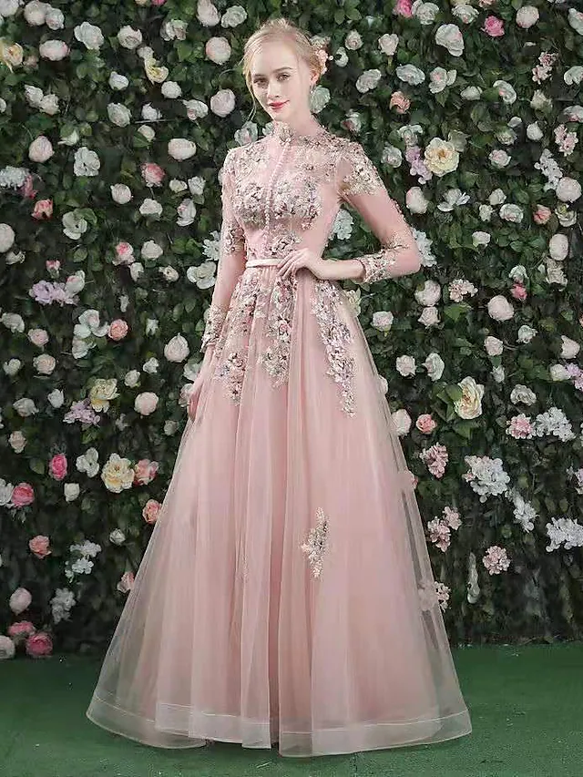 Back view of a long sleeve floral formal gown.