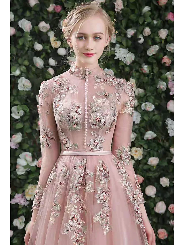 Side view of the high neck embroidered organza dress.