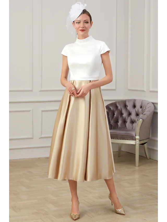 Elegant A-Line Mother of the Bride dress with high neck and short sleeves.