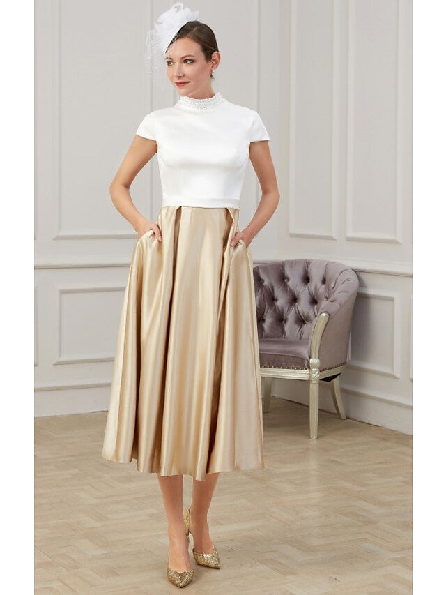 Side view of the A-Line tea length dress showing ruching details.
