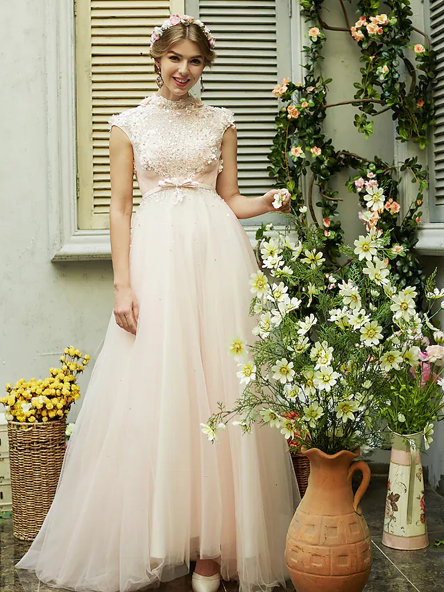 Elegant A-Line wedding dress with high neck and short sleeves.