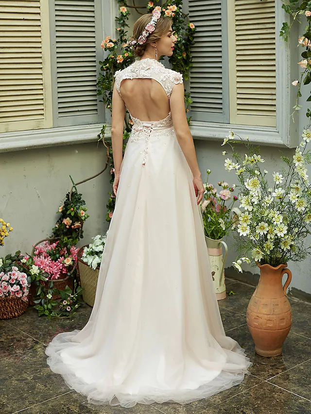 Back view of A-Line wedding dress showing open back and bowknot sash.