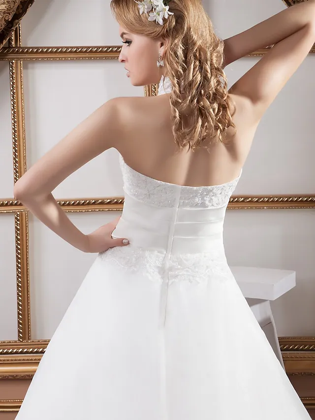 Detail of high neck and lace on A-Line wedding dress.