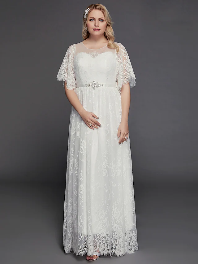 Full view of the boho-inspired A-Line wedding dress with intricate beading and lace inserts.
