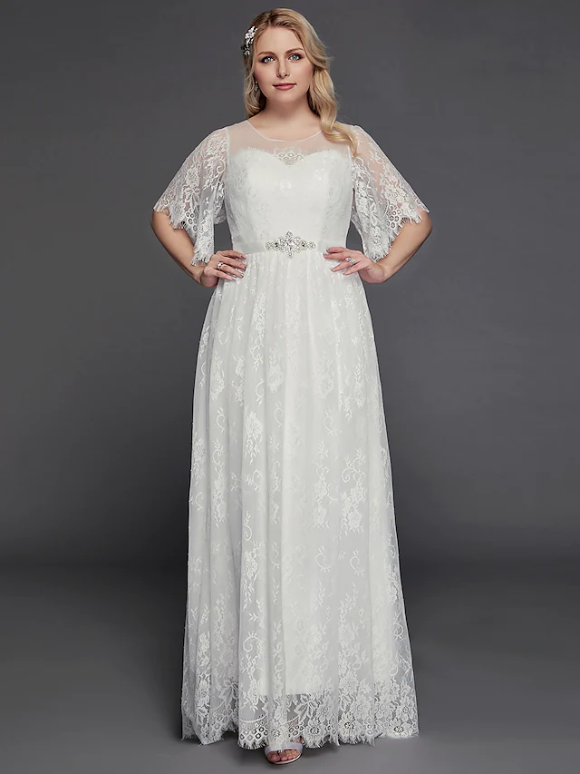 Detail of the lace and beading on the bodice and sleeves of the wedding gown.