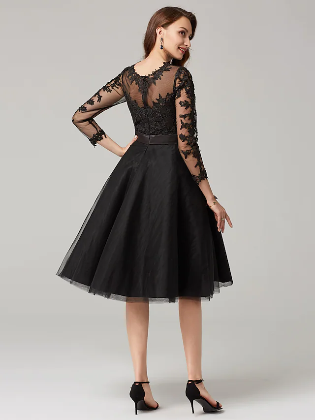 Back view of the A-line tulle and lace dress with appliques.