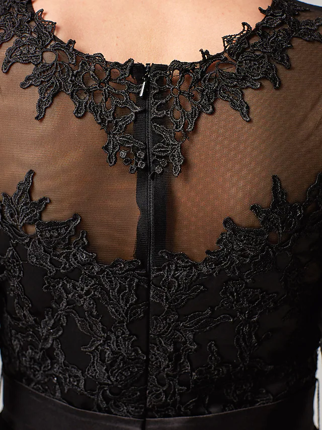 Full view of the A-line wedding guest dress, highlighting the tulle overlay.