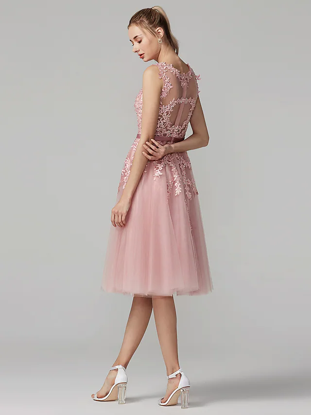 Back view of an A-line dress with beautiful floral and beaded details.