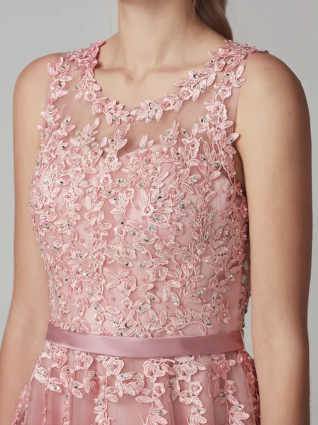 Close-up of the illusion neckline and floral beading on the dress.