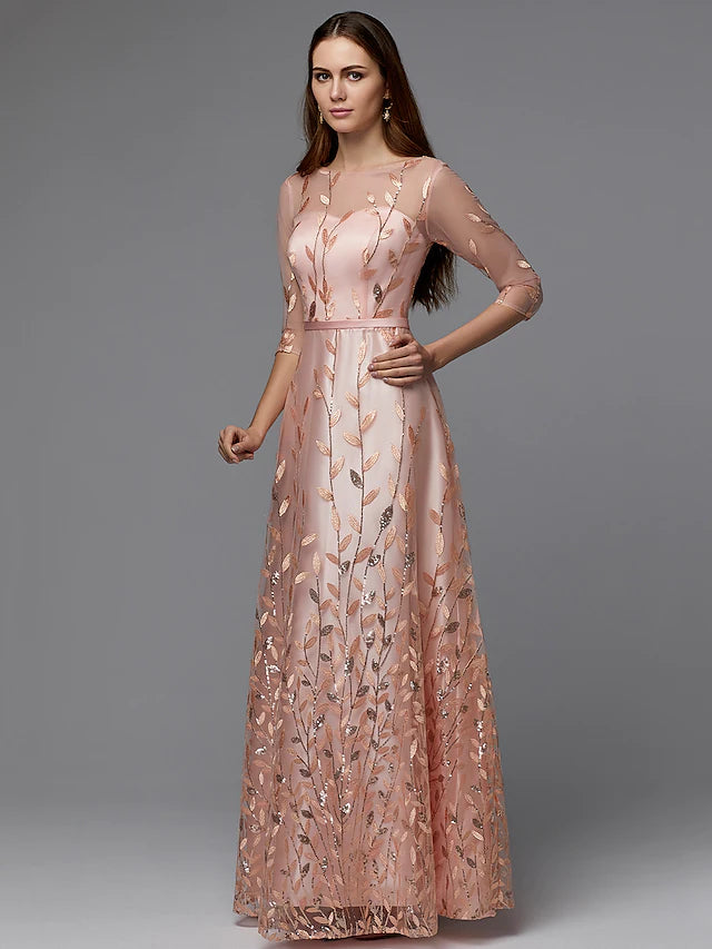 Close-up of the floral lace pattern and illusion neckline on the dress.