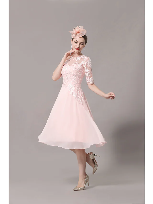 Elegant A-Line Mother of the Bride dress with illusion neckline, half sleeves, and lace over satin fabric.