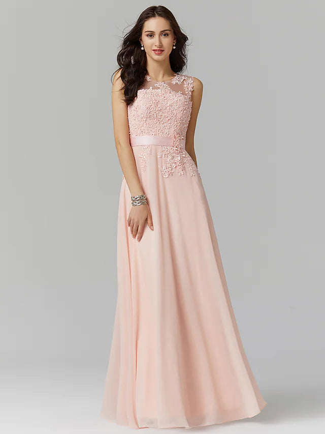 Model wearing a blue A-line evening gown with appliques and illusion neckline.