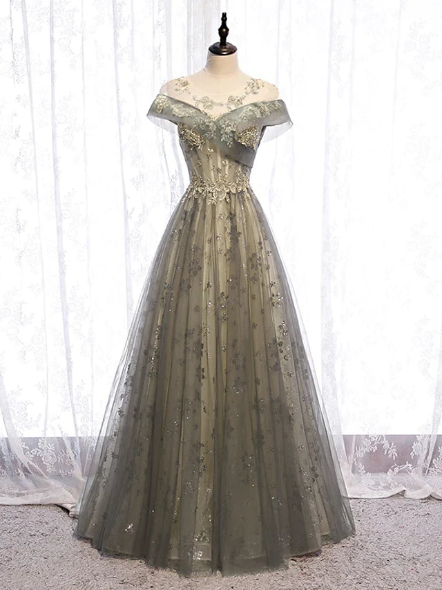 Elegant A-line evening gown with illusion neck and short sleeves.