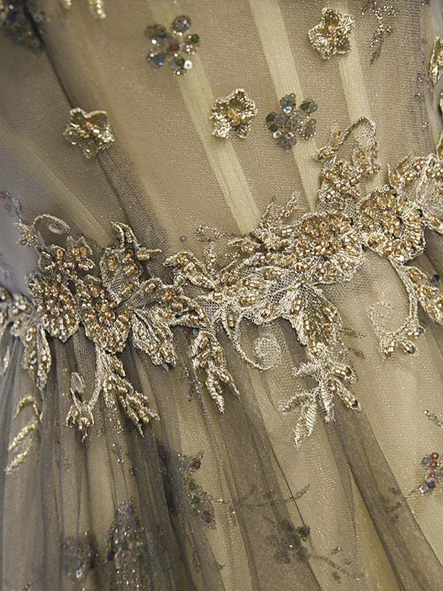 Close-up of the illusion neckline and short sleeve detail on the evening gown.