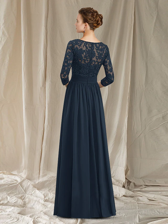 Back view of an A-line chiffon lace floor length gown with appliques and pleats.