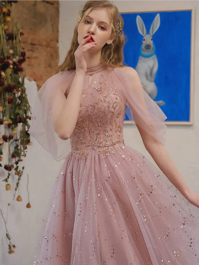Side view of a sparkling knee-length A-line dress, featuring sequin details and a sheer 3/4 sleeve.