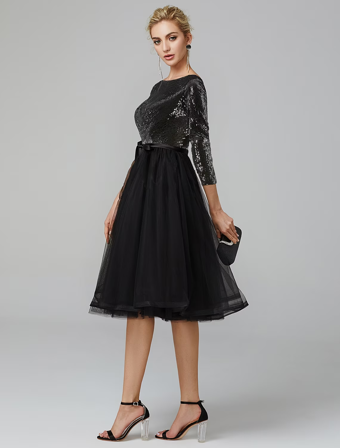 Back view of the elegant tea length cocktail dress with 3/4 sleeves.