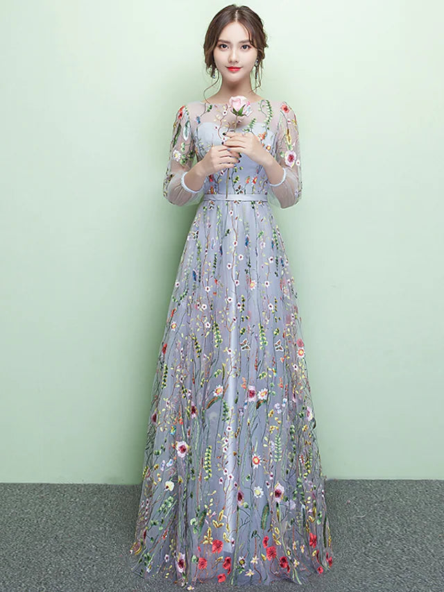 Elegant A-line formal dress with jewel neck and 3/4 sleeves.