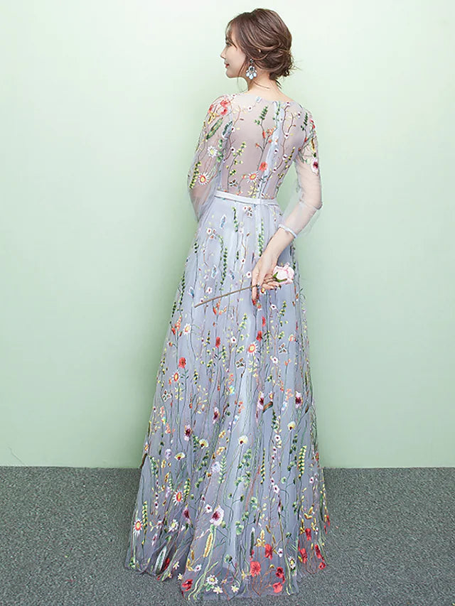 Close-up of sparkling lace and embroidery on the formal dress.