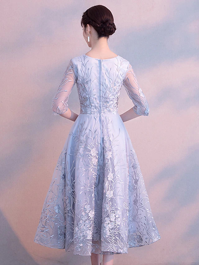 Back view of the elegant A-Line lace dress with 3/4 sleeves.