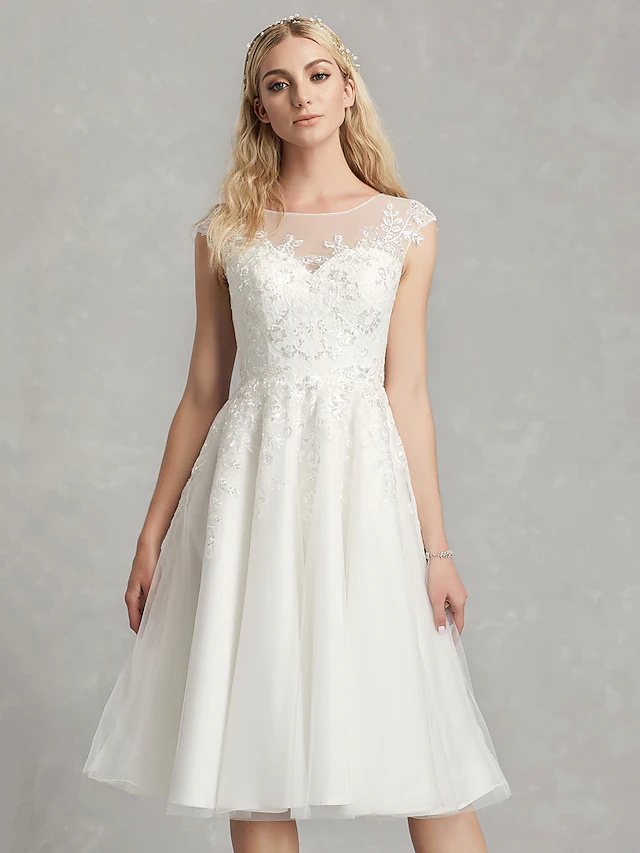 Full view of the A-Line wedding dress, highlighting the tea length.