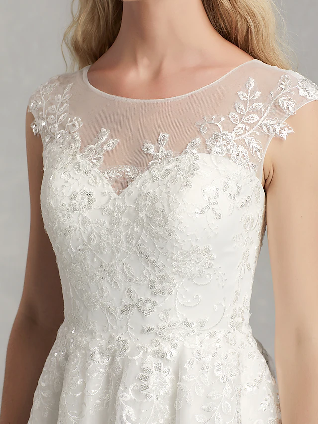Elegant back design of the A-Line wedding dress with appliques.