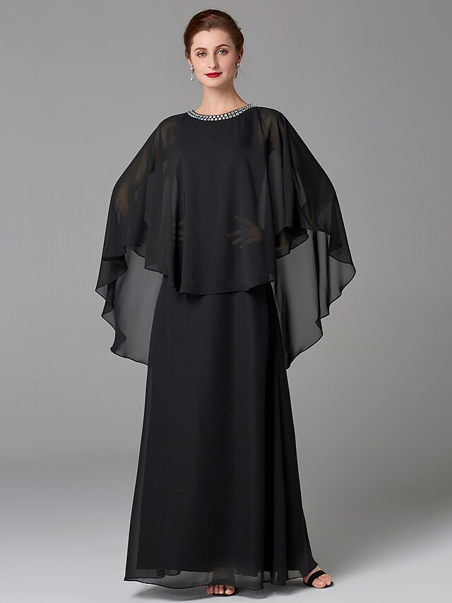 Side profile of an elegant floor-length mother of the bride gown.