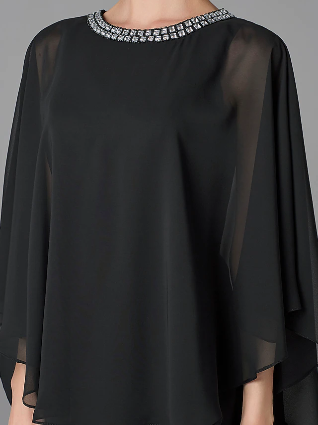 Close-up of the beaded jewel neckline on a plus size formal dress.