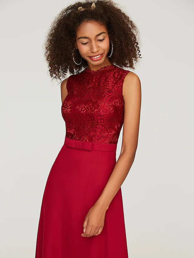 Side view of the floor-length A-line bridesmaid dress, showcasing its flowing chiffon skirt.