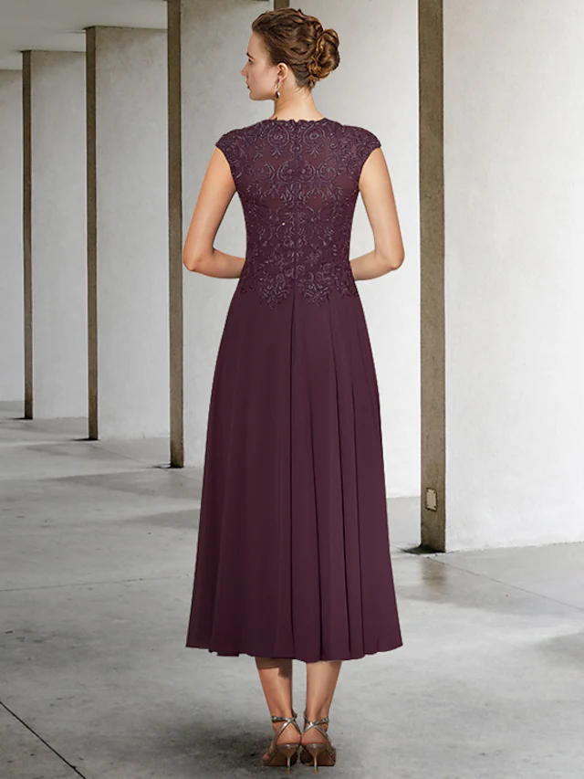 Back view of the A-Line Mother of the Bride dress showing pleats and chiffon lace.