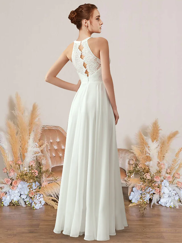 Romantic sleeveless A-Line wedding gown featuring delicate pleats and a flowing silhouette.