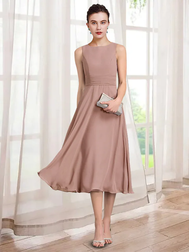 Elegant A-line Mother of the Bride dress with jewel neck, 3/4 sleeves, and lace appliques.