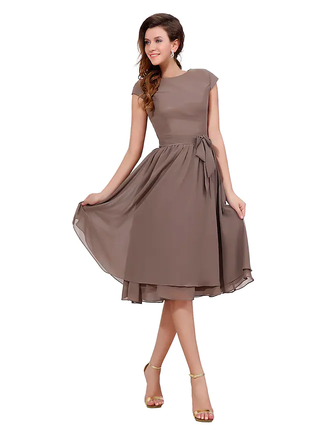 Elegant A-line chiffon dress with jewel neck and short sleeves.