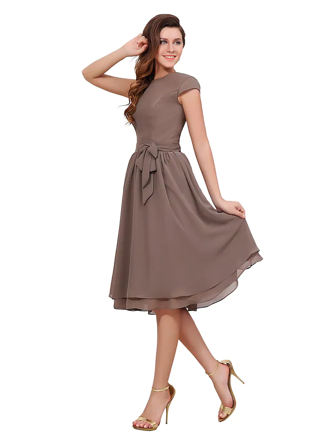 Side view of A-line knee-length chiffon dress.