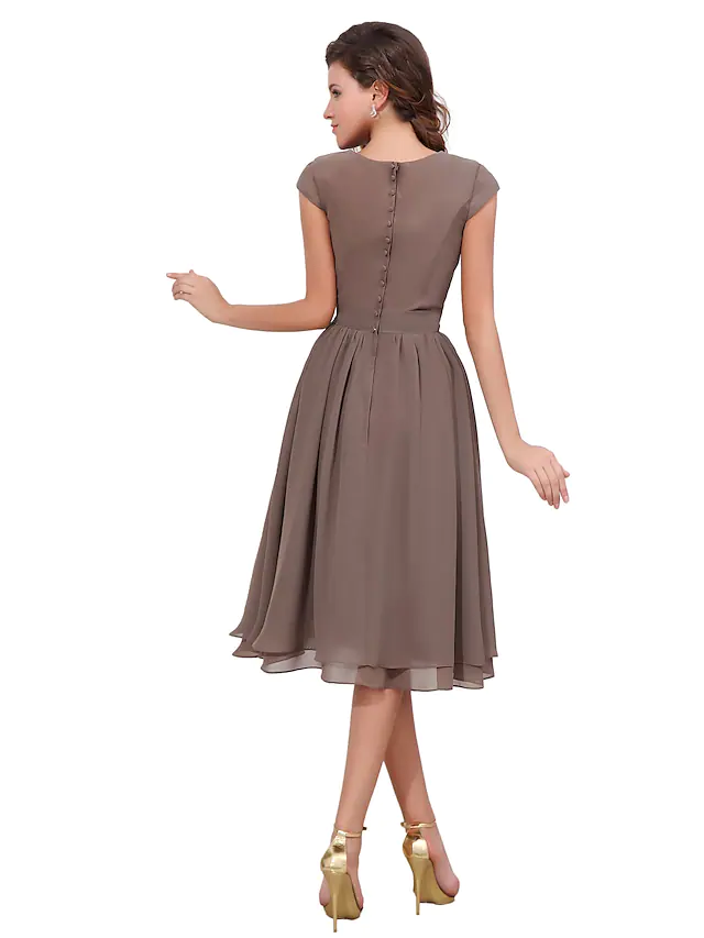 Back view of A-line dress with decorative buttons.