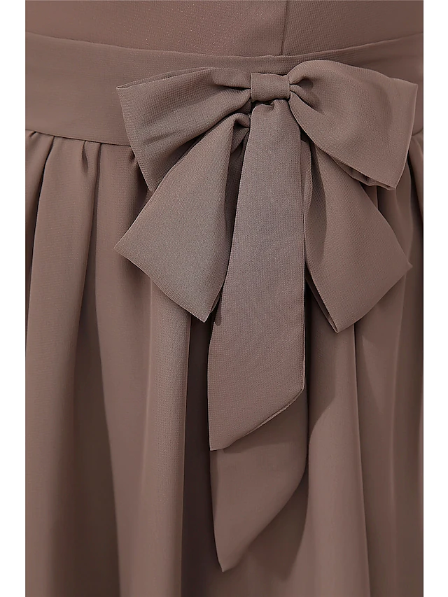 Model wearing A-line chiffon dress, showing flow.