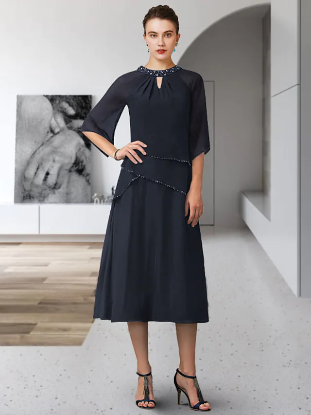 Elegant A-line Mother of the Bride dress with jewel neck, 3/4 sleeves, and sequin ruffles.