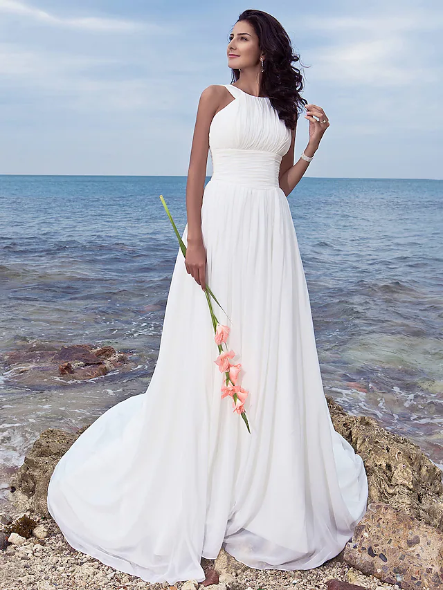 A-Line chiffon wedding dress with jewel neck and ruched draping.