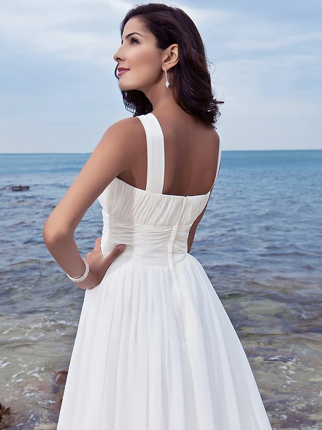 Close-up of jewel neck and regular straps on wedding gown.