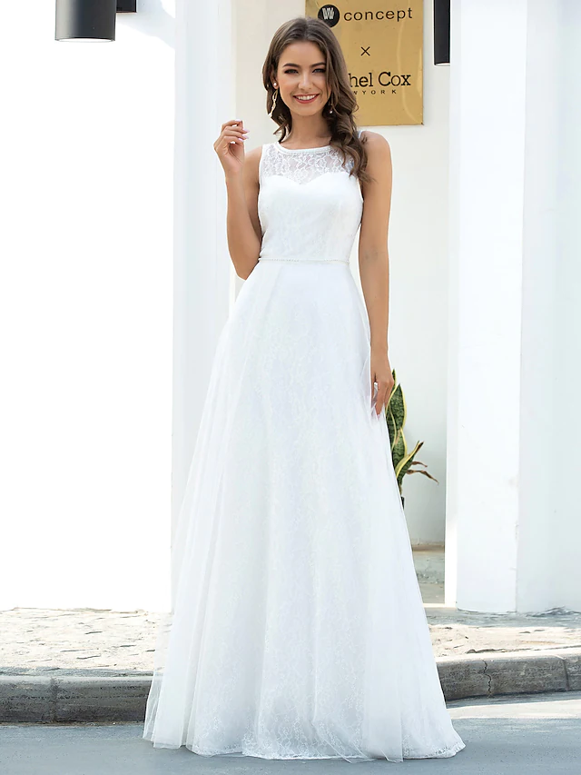 A-Line wedding dress with jewel neck, lace, and tulle fabric.