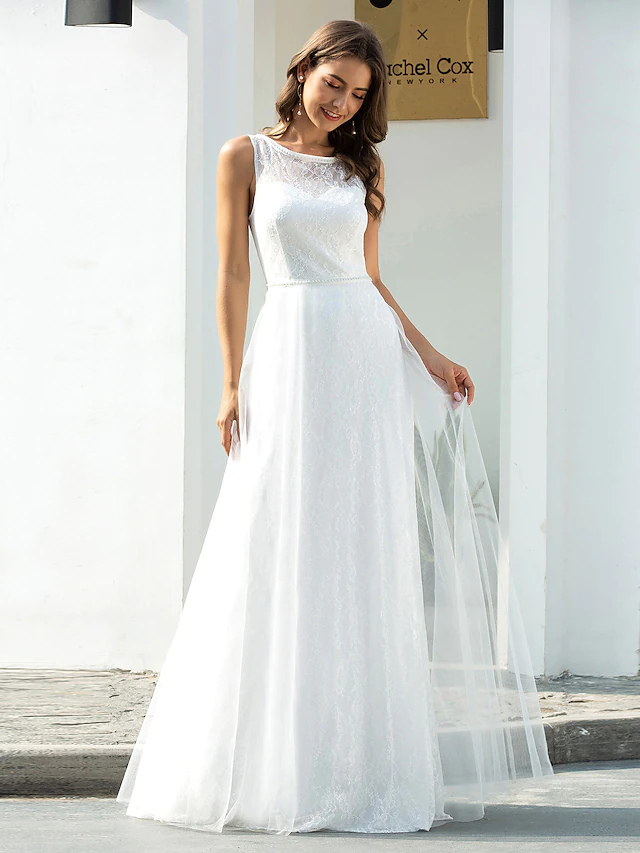 Side view of a country casual floor-length bridal gown.