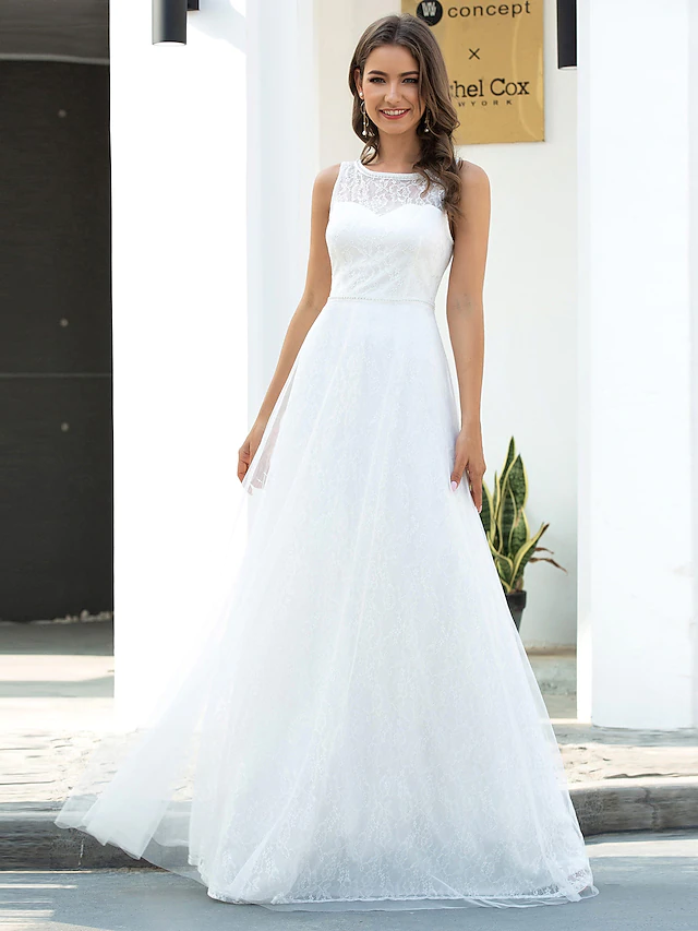 Close-up of the lace and tulle detail on a wedding dress.