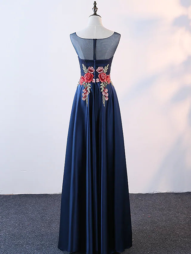Close-up of embroidery and appliques on the satin evening gown.
