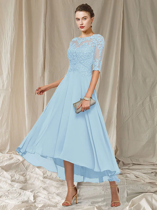 Close-up of the jewel neckline and half sleeve detail on the elegant dress.