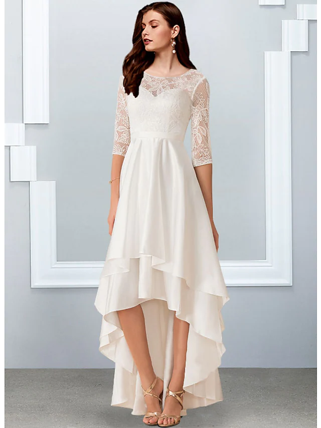 A-Line wedding dress with jewel neck, half sleeves, and cascading ruffles.